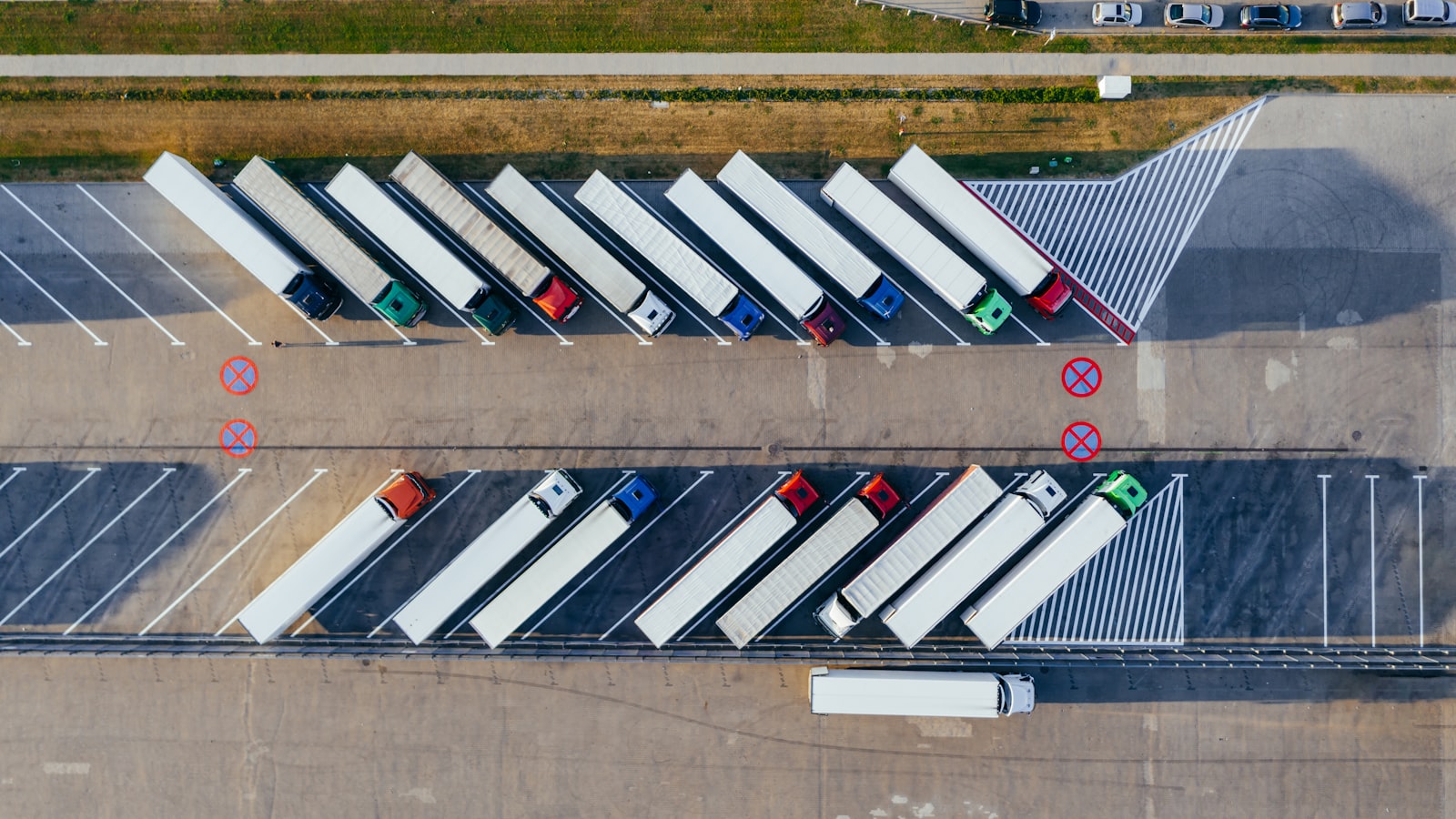 Aerial view of a truck yard with parked trailers and loading bays