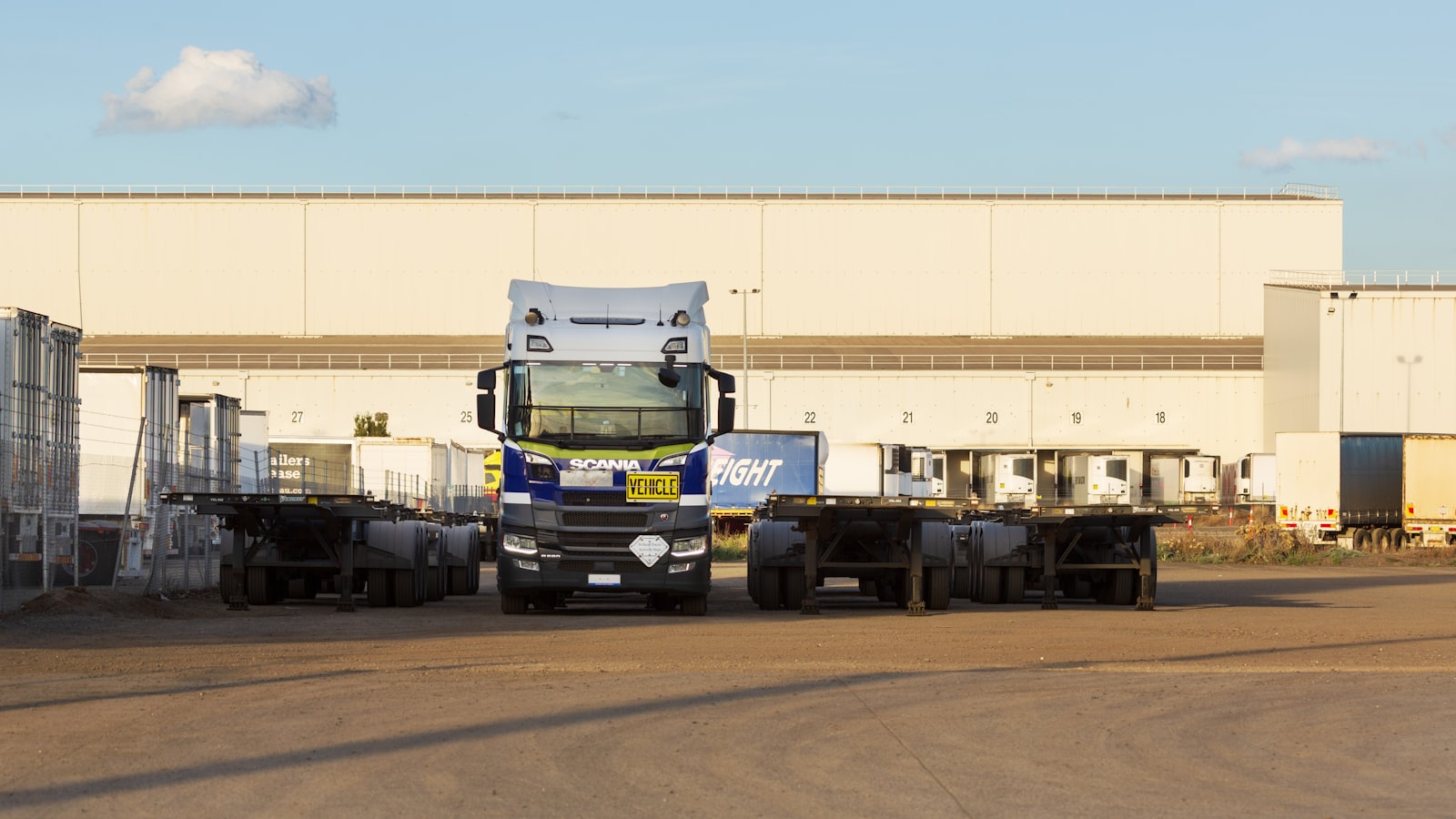 Trucks and trailers parked at a European distribution centre