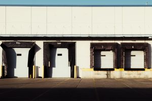 Row of closed loading dock doors at a European distribution centre