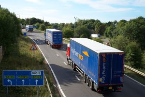 Articulated lorries on a British dual carriageway carrying European road freight