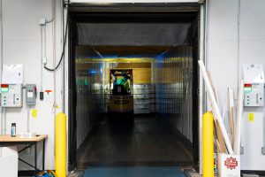 Goods being loaded into a trailer at a warehouse loading dock