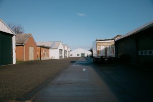 Trailer moving between warehouse buildings, the boundary between yard and warehouse systems