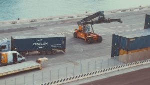 Container lorry and reach stacker at a port container terminal