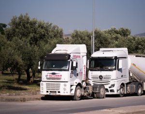 Two European tractor units parked side by side between loads